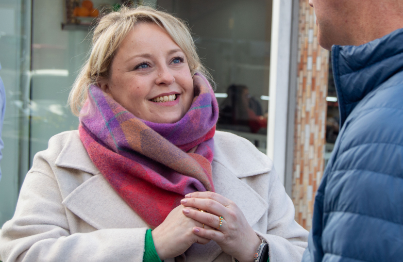 Lisa speaking with residents