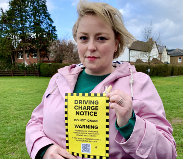 Lisa with a leaflet on the proposed ULEZ expansion